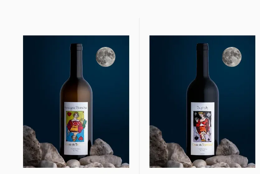 Deux bouteilles de la Cave du Bonheur, Humagne Blanche et Syrah, photographiées sous la lune sur des pierres